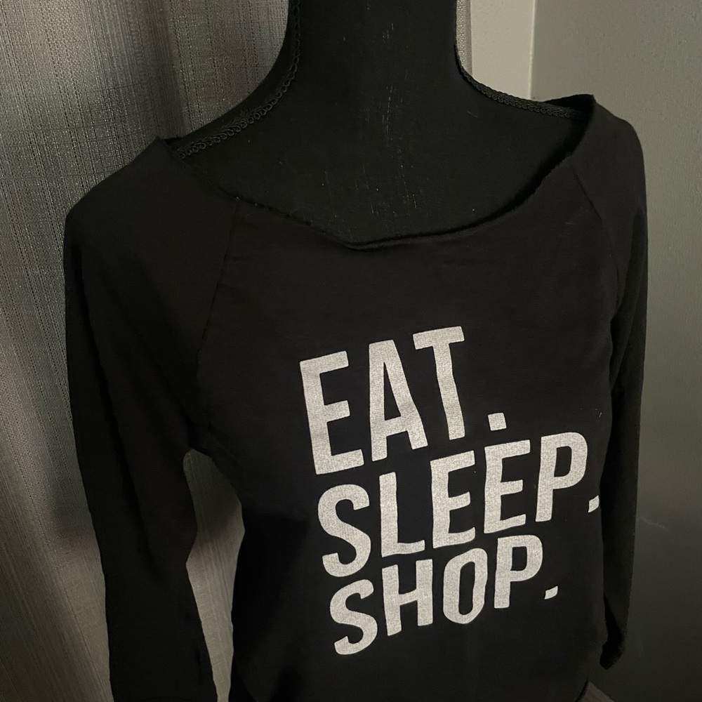 Statement sweatshirt says “eat. Sleep. Shop” super cute and fun shirt.